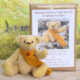 Bananaby sitting in front of the Bananaby kit box and waving