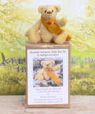 Bananaby sitting on top of the Bananaby Teddy Bear Kit box