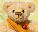 Bananaby's face showing his scarf and decorative bead