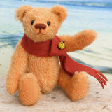 Clementine mohair teddy bear kit makes a 7.5 inch pale peach mohair teddy bear. It contains thorough instruction, lovely pale peach German mohair with the pattern drawn out on it, polyester stuffing and some glass beads to add weight, felt scarf and a decorative bead. The kit is nicely boxed so you can give it as a gift