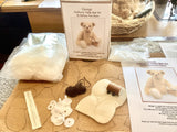 We have created this kit with everything you need including the stuffing and pellets, you just need scissors and a few things you will have at home.   The instructions are thorough but we are on hand for extra support by phone. George has beautiful straight pile antique gold German mohair which has a black thread running through it to make it more interesting. He has German wool felt pads and genuine Victorian boot button eyes.
