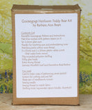 Box showing contents list: Pattern and Instructions Pale green mohair with the pattern drawn on it , 6mm glass eyes, needle for inserting eyes and sewing the nose, Green nose thread, plastic joints (that make limbs move) , stuffing, glass beads, Extra strong thread, Felt scarf and a decorative bead