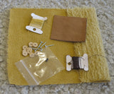 The contents of the Norman teddy bear kit, mohair, Ultrasuede for the paws, cotter pin joints, eyes, nose thread and extra strong thread. The pattern and full instructions are also included