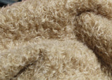 Clootie, 24 mm (nearly one inch) blond, dense, distressed mohair/viscose mix for teddy bears with a pale beige backing Clootie is a little different from out other materials, the pile is a mixture of mohair and viscose giving it a slight lustre. It has an intensely distressed tangled, blond/pale beige pile which is 24 mm (nearly) 1 inch long. It's a great colour and texture for medium and large traditional teddy bears, it's a proper 'teddy bear' colour.