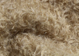 Clootie, 24 mm (nearly one inch) blond, dense, distressed mohair/viscose mix for teddy bears with a pale beige backing Clootie is a little different from out other materials, the pile is a mixture of mohair and viscose giving it a slight lustre. It has an intensely distressed tangled, blond/pale beige pile which is 24 mm (nearly) 1 inch long. It's a great colour and texture for medium and large traditional teddy bears, it's a proper 'teddy bear' colour.