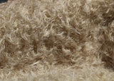 Clootie, 24 mm (nearly one inch) blond, dense, distressed mohair/viscose mix for teddy bears with a pale beige backing Clootie is a little different from out other materials, the pile is a mixture of mohair and viscose giving it a slight lustre. It has an intensely distressed tangled, blond/pale beige pile which is 24 mm (nearly) 1 inch long. It's a great colour and texture for medium and large traditional teddy bears, it's a proper 'teddy bear' colour.