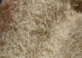 Clootie, 24 mm (nearly one inch) blond, dense, distressed mohair/viscose mix for teddy bears with a pale beige backing Clootie is a little different from out other materials, the pile is a mixture of mohair and viscose giving it a slight lustre. It has an intensely distressed tangled, blond/pale beige pile which is 24 mm (nearly) 1 inch long. It's a great colour and texture for medium and large traditional teddy bears, it's a proper 'teddy bear' colour.