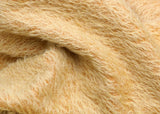 Golden Cracker 12 mm quite sparse, distressed (ratinee) mohair for teddy bears with a golden pile and warm beige backing This has a moderately short, distressed, fairy sparse, golden pile and a warm beige backing, which helps make your bear's face stand out.  It's a great colour for smaller traditional teddy bears, or larger bears that you want to look old and loved.