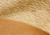 Golden Cracker 12 mm quite sparse, distressed (ratinee) mohair for teddy bears with a golden pile and warm beige backing This has a moderately short, distressed, fairy sparse, golden pile and a warm beige backing, which helps make your bear's face stand out.  It's a great colour for smaller traditional teddy bears, or larger bears that you want to look old and loved.