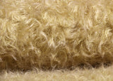 Mustard Seed, 24 mm (nearly one inch) blond, dense, distressed mohair/viscose mix for teddy bears Mustard Seed is a little different from our other materials, the pile is a mixture of mohair and viscose giving it a slight lustre. It has an intensely distressed tangled, blond pile which is 24 mm (nearly) 1 inch long. It's a great colour and texture for medium and large traditional teddy bears, it's quite a 'happy'teddy bear' colour, a good colour for making happy teddy bears.
