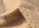 Porridge 11 mm quite sparse, wildly distressed, mohair for teddy bears with a soft, pale peachy cream pile and backing. It's a great mohair for smaller traditional teddy bears, or larger bears, good for cute happy bears, or ,with some shading, teddies that you want to look old and loved.