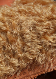 Toffee Truffle 25 mm (one inch) antique gold, dense, distressed mohair for teddy bears with a cinnamon backing Toffee Truffle is a gorgeous antique gold/cinnamon mohair (it's a little redder/more ginger than Truffle) with a soft and fluffy 1 inch pile. It's a great colour for medium and large traditional teddy bears, it's a proper, old fashioned 'teddy bear' colour.
