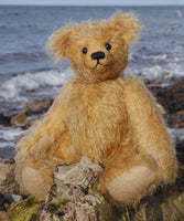 Brannigan sitting on a log by the sea at Girvan in south west Scotland. 
Brannigan Mohair Teddy Bear Kit. A jointed teddy bear kit by Make A Teddy to make an 8.5 inch/22 cm teddy bear.
We have created this kit with everything you need with lovely beige German mohair, apart from scissors and a few things you will have at home. The instructions are thorough and illustrated