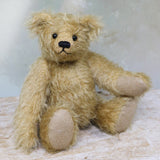 Brannigan sitting. 
Brannigan Mohair Teddy Bear Kit. A jointed teddy bear kit by Make A Teddy to make an 8.5 inch/22 cm teddy bear.
We have created this kit with everything you need with lovely beige German mohair, apart from scissors and a few things you will have at home. The instructions are thorough and illustrated