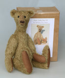 Hank teddy bear with his teddy bear kit box labelled 'Hank Teddy Bear Kit by Barbara Ann Bears' 