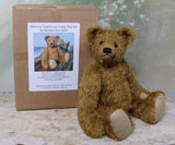 Harrison teddy bear sitting down by his kit box.
Harrison Traditional Mohair Heirloom Teddy Bear Kit. A jointed teddy bear kit by Make A Teddy to make a 14 inch (35 cm) teddy bear. We have created this kit with everything you need with clear instructions with diagrams, you just need scissors and a few things you will have at home.