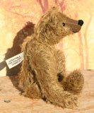 Mainwaring's elegant classical profile sitting down, a bear made from the Mainwaring Mohair Teddy Bear Kit. A jointed teddy bear kit in brown mohair by Make A Teddy to make an 8 inch/20 cm teddy bear.