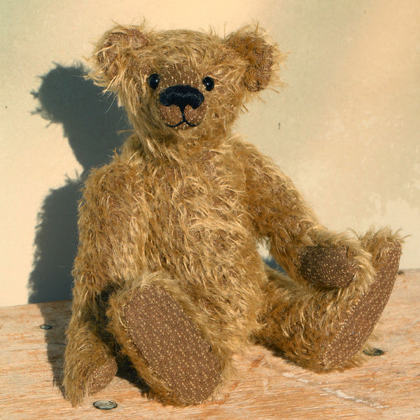 Mainwaring sitting down, a bear made from the Mainwaring Mohair Teddy Bear Kit. A jointed teddy bear kit in brown mohair by Make A Teddy to make an 8 inch/20 cm teddy bear.