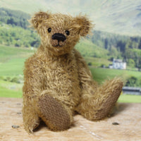 Mainwaring sitting down, a bear made from the Mainwaring Mohair Teddy Bear Kit. A jointed teddy bear kit in brown mohair by Make A Teddy to make an 8 inch/20 cm teddy bear.