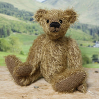 Mainwaring sitting down, a bear made from the Mainwaring Mohair Teddy Bear Kit. A jointed teddy bear kit in brown mohair by Make A Teddy to make an 8 inch/20 cm teddy bear.