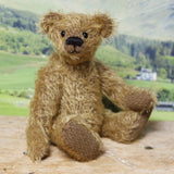 Mainwaring sitting down, a bear made from the Mainwaring Mohair Teddy Bear Kit. A jointed teddy bear kit in brown mohair by Make A Teddy to make an 8 inch/20 cm teddy bear.