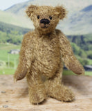 Mainwaring standing, a bear made from the Mainwaring Mohair Teddy Bear Kit. A jointed teddy bear kit in brown mohair by Make A Teddy to make an 8 inch/20 cm teddy bear.