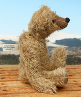 Mainwaring sitting down profile, a bear made from the Mainwaring Mohair Teddy Bear Kit. A jointed teddy bear kit in brown mohair by Make A Teddy to make an 8 inch/20 cm teddy bear.