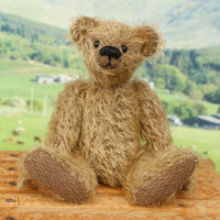 Mainwaring sitting down, a bear made from the Mainwaring Mohair Teddy Bear Kit. A jointed teddy bear kit in brown mohair by Make A Teddy to make an 8 inch/20 cm teddy bear.