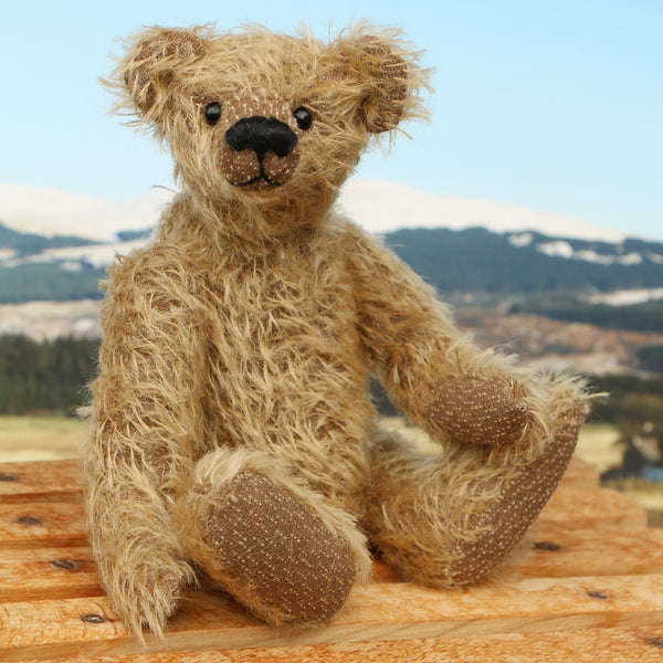 Mainwaring sitting down, a bear made from the Mainwaring Mohair Teddy Bear Kit. A jointed teddy bear kit in brown mohair by Make A Teddy to make an 8 inch/20 cm teddy bear.