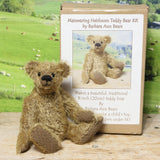 Mainwaring teddy bear sitting beside his kit box