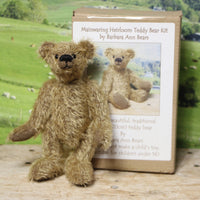 Mainwaring teddy bear standing beside his kit box