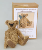 Mainwaring teddy bear sitting in front of his kit box