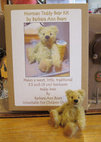 Norman teddy bear with the box containing the Norman teddy bear kit