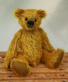 Ogilvy sitting  down and looking sweet. Ogilvy Mohair Teddy Bear Kit. A jointed teddy bear kit by Make A Teddy to make a 9 inch/23 cm teddy bear.