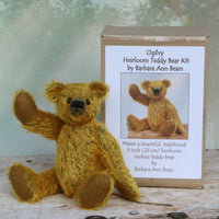 Ogilvy sitting  beside the kit box. Ogilvy Mohair Teddy Bear Kit. A jointed teddy bear kit by Make A Teddy to make a 9 inch/23 cm teddy bear.