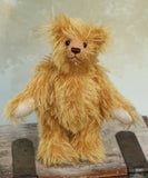 Podgerson teddy bear made from the Podgerson teddy bear kit standing on a wooden surface 