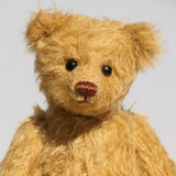 Rafferty is a very sweet teddy bear and he's quite easy to make. Rafferty has beautiful distressed antique gold German mohair, German wool felt pads and genuine Victorian boot button eyes.