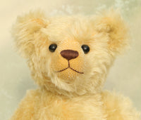 Sandy Teddy Bear Kit by Make A Teddy, showing our Sandy teddy bear 's face made from beautiful gold mohair with boot button eyes and a chestnut coloured nose embroidered from DMC soft cotton