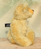 Sandy Teddy Bear Kit by Make A Teddy, showing our Sandy teddy bear in beautiful gold mohair sitting down showing his profile