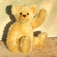 Sandy Teddy Bear Kit by Make A Teddy, showing our Sandy teddy bear in beautiful gold mohair sitting down and waving