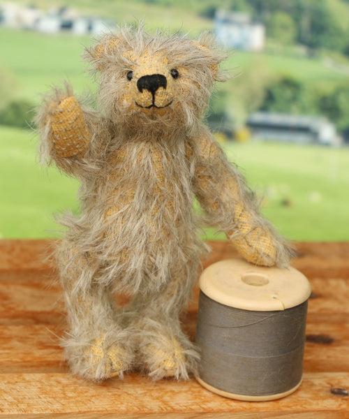 William standing by a sewing reel to give a sense of scale. William Miniature Mohair Teddy Bear Kit. A jointed teddy bear kit by Make A Teddy to make a 4 inch/10 cm teddy bear.