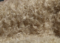 Clootie, 24 mm (nearly one inch) blond, dense, distressed mohair/viscose mix for teddy bears with a pale beige backing Clootie is a little different from out other materials, the pile is a mixture of mohair and viscose giving it a slight lustre. It has an intensely distressed tangled, blond/pale beige pile which is 24 mm (nearly) 1 inch long. It's a great colour and texture for medium and large traditional teddy bears, it's a proper 'teddy bear' colour. 