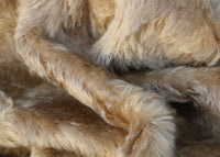 Fudge 20 mm soft brown mohair for teddy bears with a slight swirl in the pile and a brown backing Fudge is a luxurious brown mohair with a soft and fluffy pile and a beige backing. It's a great colour for medium and large traditional teddy bears, it's soft colour makes it particularly suitable for bears you want to look old and have a bit of character.