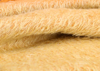 Golden Cracker 12 mm quite sparse, distressed (ratinee) mohair for teddy bears with a golden pile and warm beige backing This has a moderately short, distressed, fairy sparse, golden pile and a warm beige backing, which helps make your bear's face stand out.  It's a great colour for smaller traditional teddy bears, or larger bears that you want to look old and loved. 