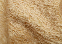 Shortcake 12 mm quite sparse, distressed (ratinee) mohair for teddy bears with a soft beige pile and backing This has a moderately short, distressed, fairy sparse, beige pile and a slightly warmer beige backing, which helps make your bear's face stand out a little.  It's a great colour for smaller traditional teddy bears, or larger bears that you want to look old and loved. 